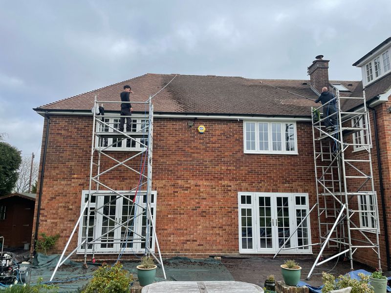 Roof cleaning carried out safely from scaffold towers by The Roof Moss Cleaners in Marchwood
